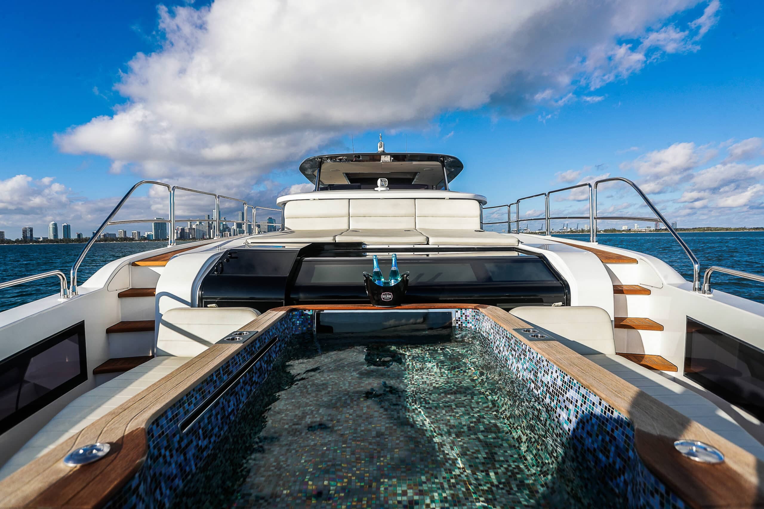 Yacht deck jacuzzi with the Miami skyline in the background